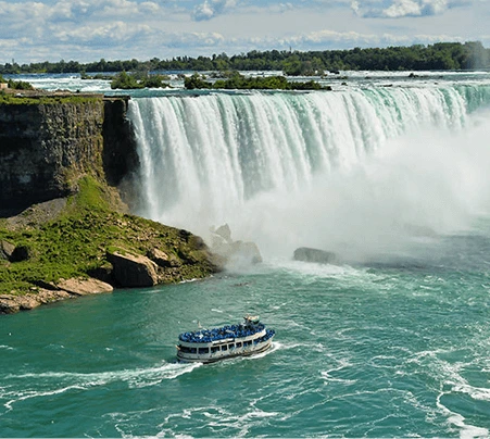 A tour boat heads towards Niagara Falls